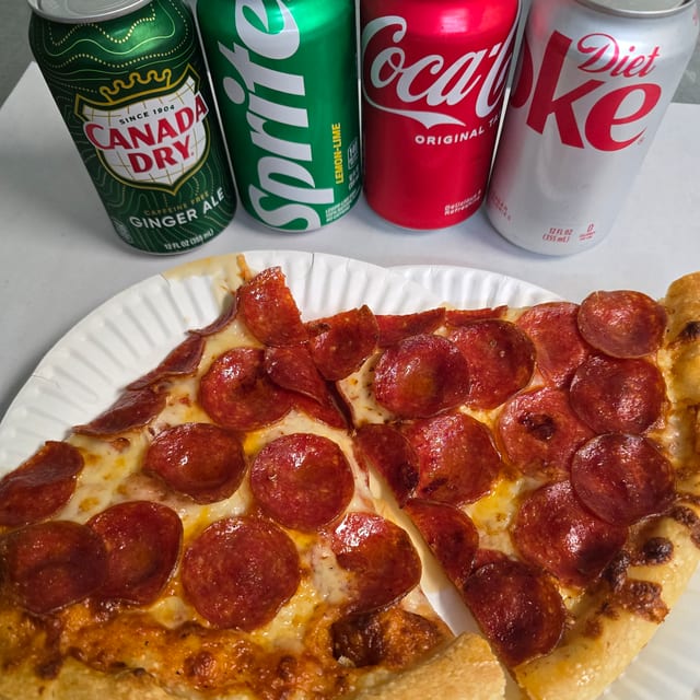 2 Slices of Pepperoni and a Can of Soda.